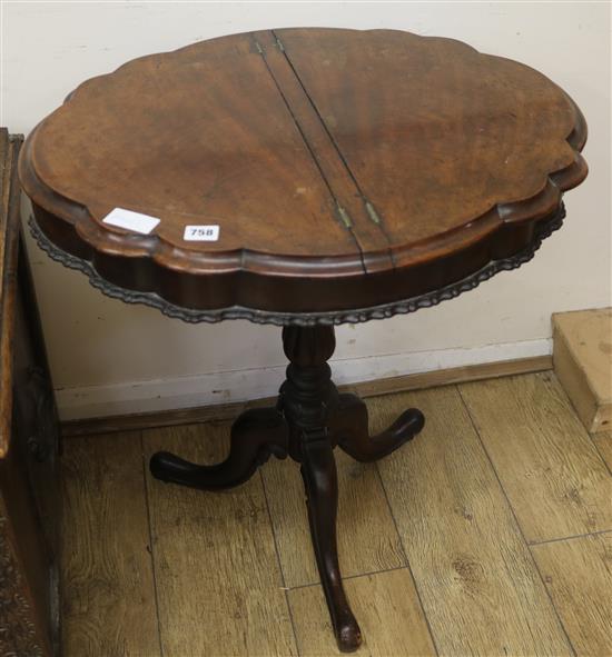 A Victorian walnut tripod base work table, W.66cm